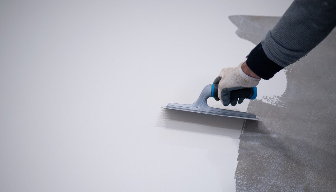 worker works with polyurethane resin for interiors